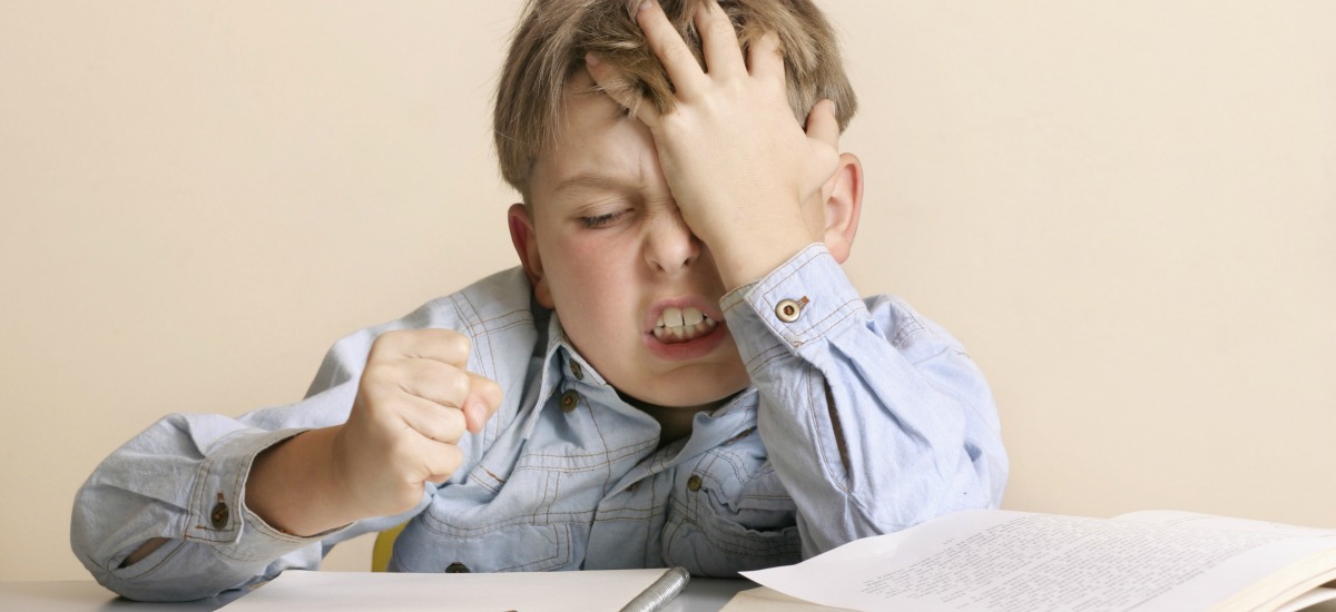Frustrated boy doing homework
