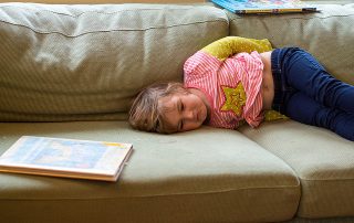 Child pouting on couch
